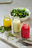 Three salad dressings - Caesar's, herb vinaigrette, berry dressing