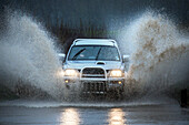 Car driving on flooded road