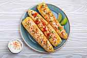 Elotes, grilled corn with cotija cheese (Mexico)