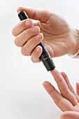 Close up of Woman's Hands Using Glucose Meter