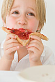 Boy Eating Jam on Toast