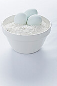 Mixing Bowl with Eggs and Flour