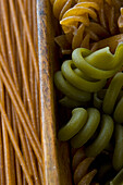 Green and Whole Wheat Pasta in Wooden Drawer