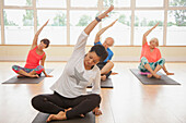 People Practicing Yoga at Yoga Studio