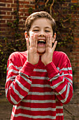 Portrait of Young Boy Shouting Outdoors