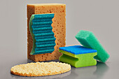 Still life variety of cleaning sponges on gray background