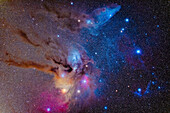 There's no more colorful area of the deep-sky than this field in the head of Scorpius. A mix of red and magenta emission nebulas combine with blue reflection nebulas, and unique to this field, a yellow reflection nebula around the red giant star Antares at bottom. Dark dust lanes glow brown and yellow as well.