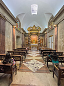 Worshippers in a side chapel in the Metropolitan Cathedral, Buenos Aires, Argentina.