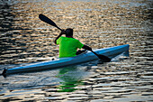 Kayakers at sunset on the Ebro River, Zaragoza, Spain