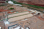 The Intrepid Potash Mine processing facility near Moab, Utah. The long potash storage buildings are in front.