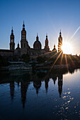 Cathedral-Basilica of Our Lady of the Pillar and the Ebro River bank at sunset, Zaragoza, Spain