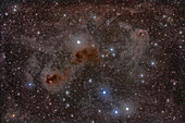 This is a framing of dust clouds among the stars of the Hyades star cluster in Taurus.