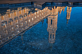 Cathedral-Basilica of Our Lady of the Pillar reflected on the fountain water in El Pilar Square, Zaragoza, Spain