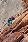 A young boy, age 6, learning to rock climb in Hunter Canyon near Moab, Utah.