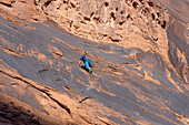 A young boy, age 6, learning to rock climb in Hunter Canyon near Moab, Utah.