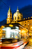 Trams below Baroque St. Nicholas Church, Malostranske Square, Lesser Town (Mala Strana), Prague, Czechia, Europe