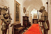 Interior decoration with Medieval steel knights' armour in a corridor with paintings, Peles Castle, Sinaia, Romania, Europe