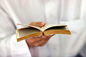 Muslim man reading an Arabic Holy Quran (Koran), Jamiul Azhar Mosque, Vietnam, Indochina, Southeast Asia, Asia