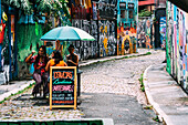 Beco do Batman, the nickname for the area around the Vila Madalena neighborhood with its dense concentation of graffiti lining the streets, popular with tourists, Sao Paulo, Brazil, South America