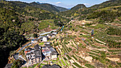 Aerial of Taxia village and Fujian Tulou, rural dwelling of the Hakka, Fujian, China, Asia