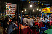 Students from Chiang Mai University eating in street food market, Chiang Mai, Thailand, Southeast Asia, Asia