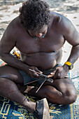 Aboriginal man, Yolngu elder, making a spear for hunting, Bawaka Homeland, East Arnhem Land, Northern Territory, Australia, Pacific