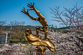 Sculpture and cherry blossom, Kyoto, Honshu, Japan, Asia