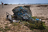 Net in the shape of a Fish full of Plastic Containers and Plastic Waste with extra plastic spilling out, Praia de Santa Maria Beach, Santa Maria, Sal, Cape Verde Islands, Atlantic, Africa