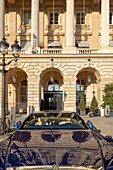 France, Paris, facade of the Crillon Hotel Place de la Concorde and luxury car