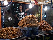 Egypt, Upper Egypt, Nubia, Nile Valley, souk of Aswan, Market in downtown Aswan, seller of oriental pastries