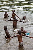 Rwanda, Lake Kivu, group of children bathing in Lake Kivu