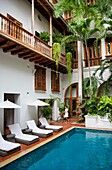 Colombia, Bolivar Department, Cartagena, listed as World heritage by UNESCO, swimming pool in the colonial patio of the San Augustin boutique-hotel