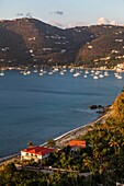 West Indies, British Virgin Islands, Tortola Island, in the Bay of Cane Garden sailboats at anchor, on the mountains some houses