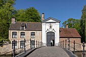 Belgium, Western Flanders, Bruges, historical centre listed as World Heritage by UNESCO, gateway to the princely beguinage of the Vine dating from 1776 and the bridge to the arches