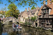 Belgium, Western Flanders, Bruges, historical centre listed as World Heritage by UNESCO, cruising tourist boat passing under the Bonifacius bridge