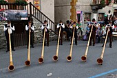 Switzerland, Valais Canton, Val d'Herens, Village of Evolene, folkloric summer festival, alpine horn players