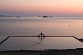 France, Ille et Vilaine, Saint Malo, Bon Secours Beach, diving board and sea water pool at sunset