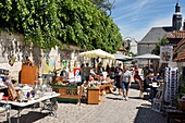 France, Pas de Calais, Montreuil sur Mer, rue du Clape in Bas, flea market with the chapel of the Orphanage in the background