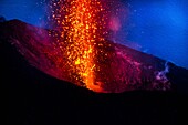 Italy, Sicily, Eolian Islands, Tyrrhenian sea, San Vincenzo, summit of Stromboli volcano 924 m, eruption of lava and projection of volcanic bombs from the central craters