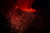 Italy, Sicily, Eolian Islands, Tyrrhenian sea, San Vincenzo, summit of Stromboli volcano 924 m, eruption of lava and projection of volcanic bombs from the central craters