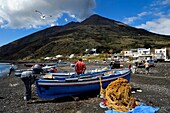 Italy, Sicily, Aeolian Islands, listed as World Heritage by UNESCO, Stromboli island, fishermen on the beach of Scari and the volcano Stromboli in the background