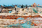 Marocco, Oued Ed-Dahab, Dakhla, Lassarga, fishermen preparing their fishing nets on the beach