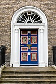 Ireland, Dublin, Merrion Square, the famous colorful doors and their brass knobs and handles typically from Georgian art