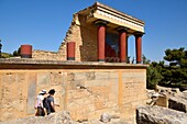 Greece, Crete, Knossos, archeological site, Palace of King Minos, the North entrance columns with bull capture fresco