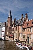 Belgium, West Flanders, Bruges, historical center listed as a UNESCO World Heritage, boats seen from the quay of the Rosary and passing next to the House of Tanners dating from the seventeenth century