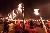 United Kingdom, Scotland, Shetland Islands, Mainland, Lerwick, Up Helly Aa festival, squad of Guizers parading to the site where the viking longship will be set on fire