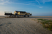 A Wooden, Elevated Beach House on North Beach / Noorderstrand on Schiermonnikoog Island, is used as Home Base of Kiters, Surfers and various other Watersports Enthousiasts. Wadden Sea, Groningen, Netherlands.