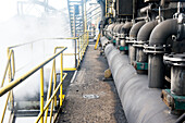 Huge, heavy steel production plant and industry terrain, producing various kinds of steel inside an CO2 Emitting and Exhausting Factory. IJmuiden, Netherlands.