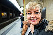 Brussels, Belgium. Blonde Iranian woman waiting for her International Train on a Brussels Central Station Underground Platform. Bruxxeles, Belgium