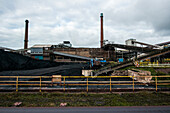 Huge, heavy steel production plant and industry terrain, producing various kinds of steel inside an CO2 Emitting and Exhausting Factory. IJmuiden, Netherlands.